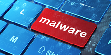 tasto rosso di computer con scritta malware in bianco